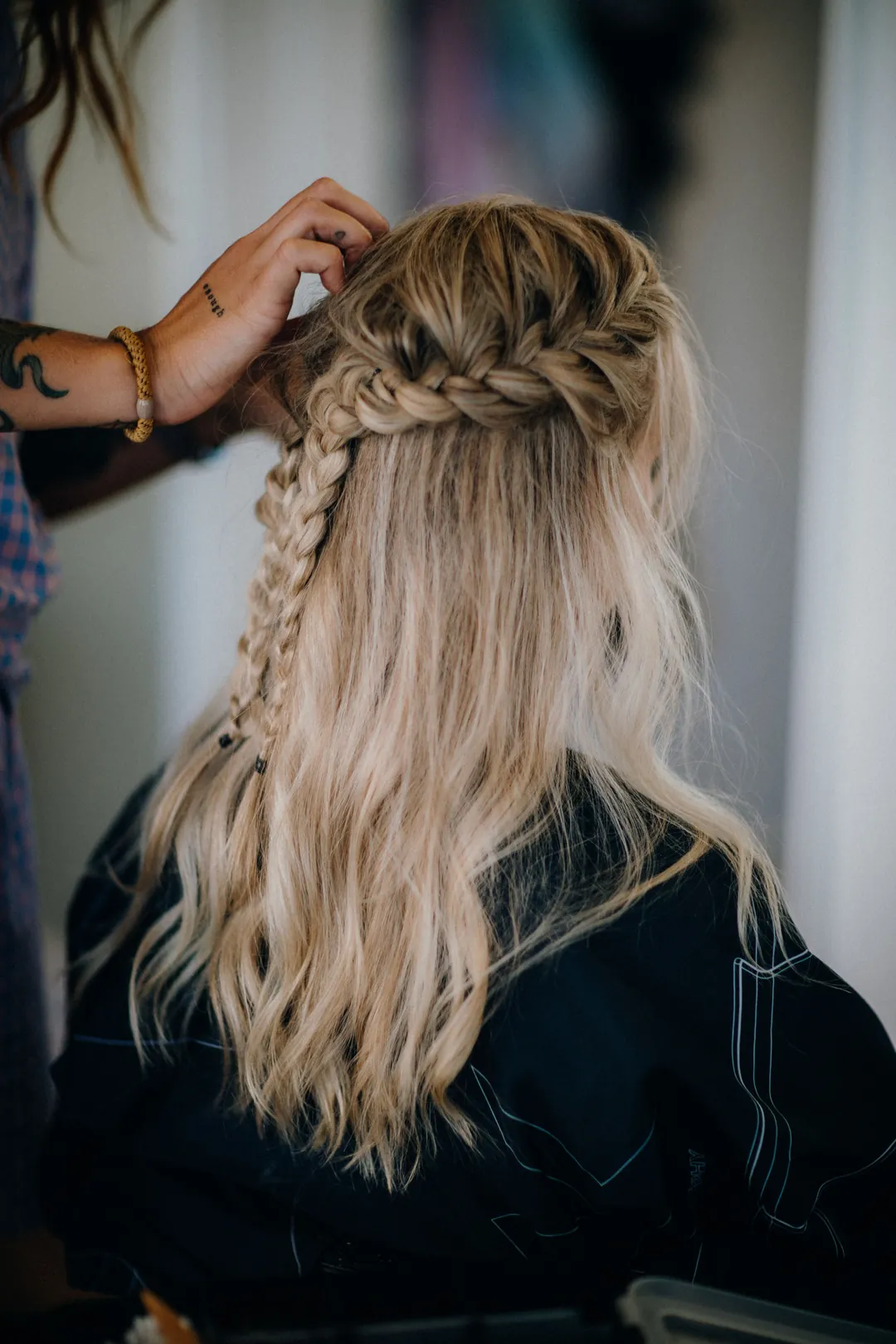 A half-up braid in long blonde hair