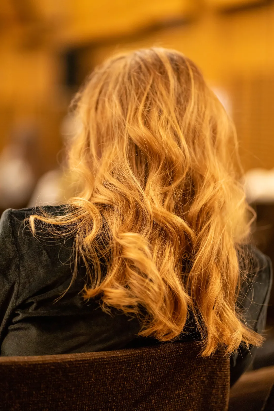 Copper waves from behind in warm light