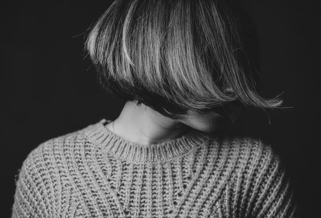 A graduated bob from behind, black and white