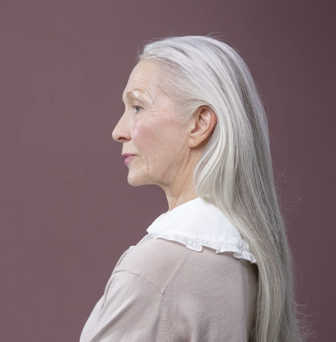 Long silver hair in profile