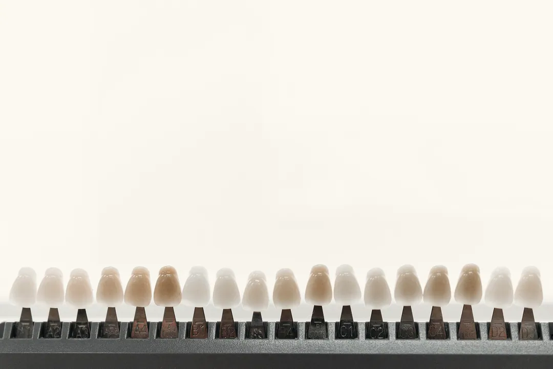 A shade guide of tooth-coloured tabs on a white background