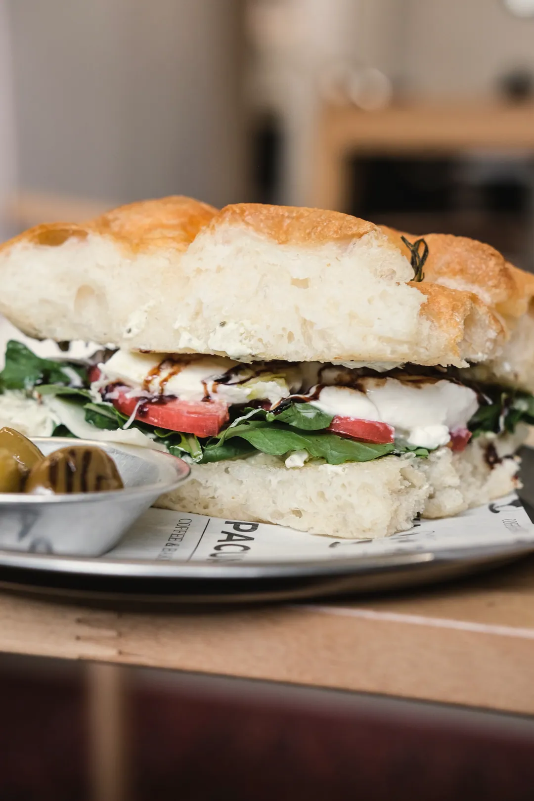 A focaccia sandwich with greens
