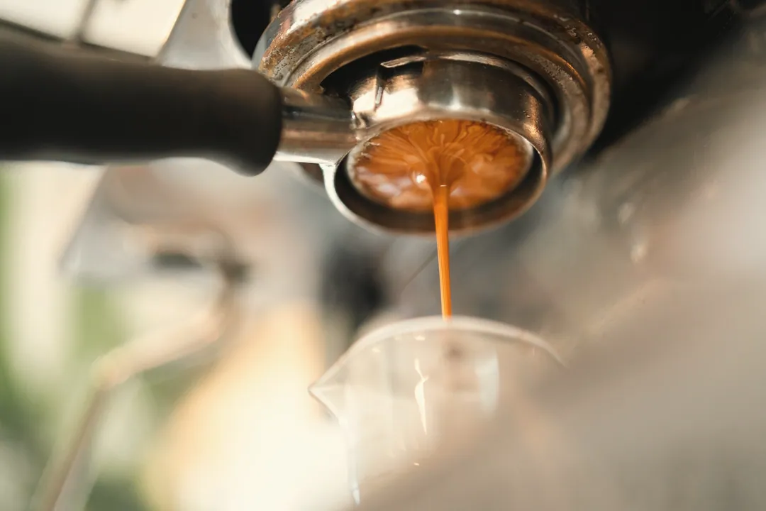 An espresso running from the portafilter