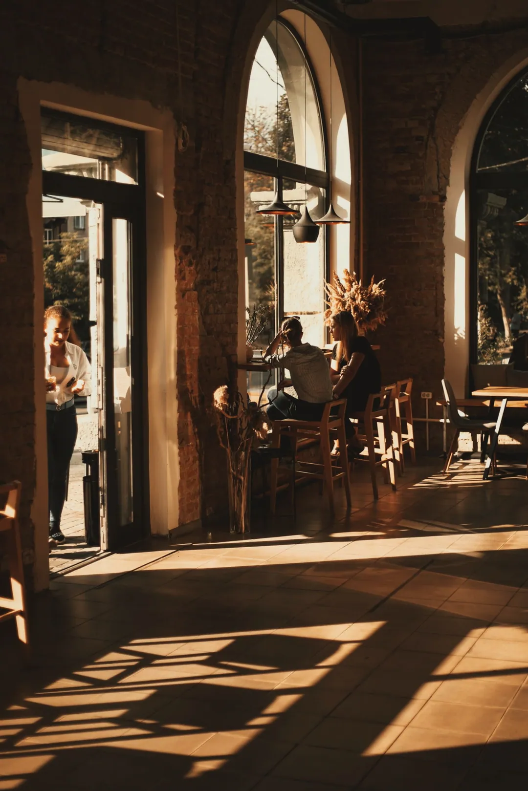 Low sun through arched doors onto the floor