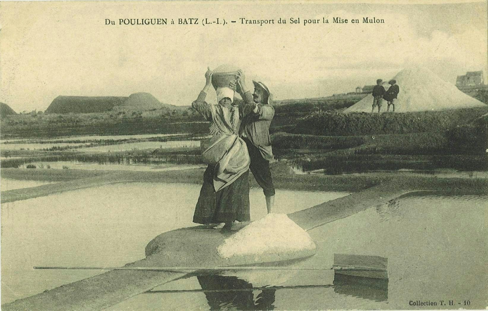 Postcard: a woman carries a basket of salt on her head along a bank toward the mulon.