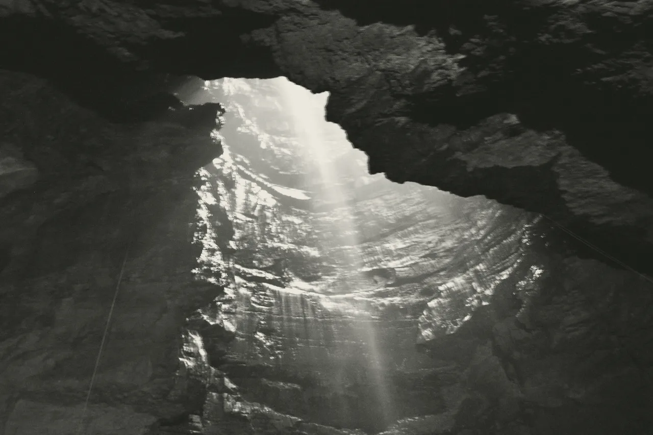 Fell Beck falling into the open shaft of Gaping Gill on Ingleborough