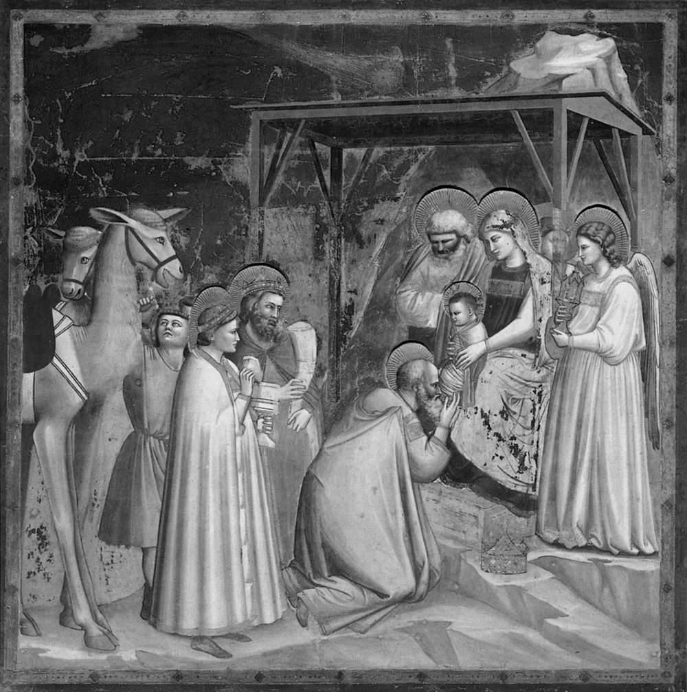 Giotto’s fresco of the Adoration of the Magi: the three kings at the stable, a comet with a long tail above the roof.