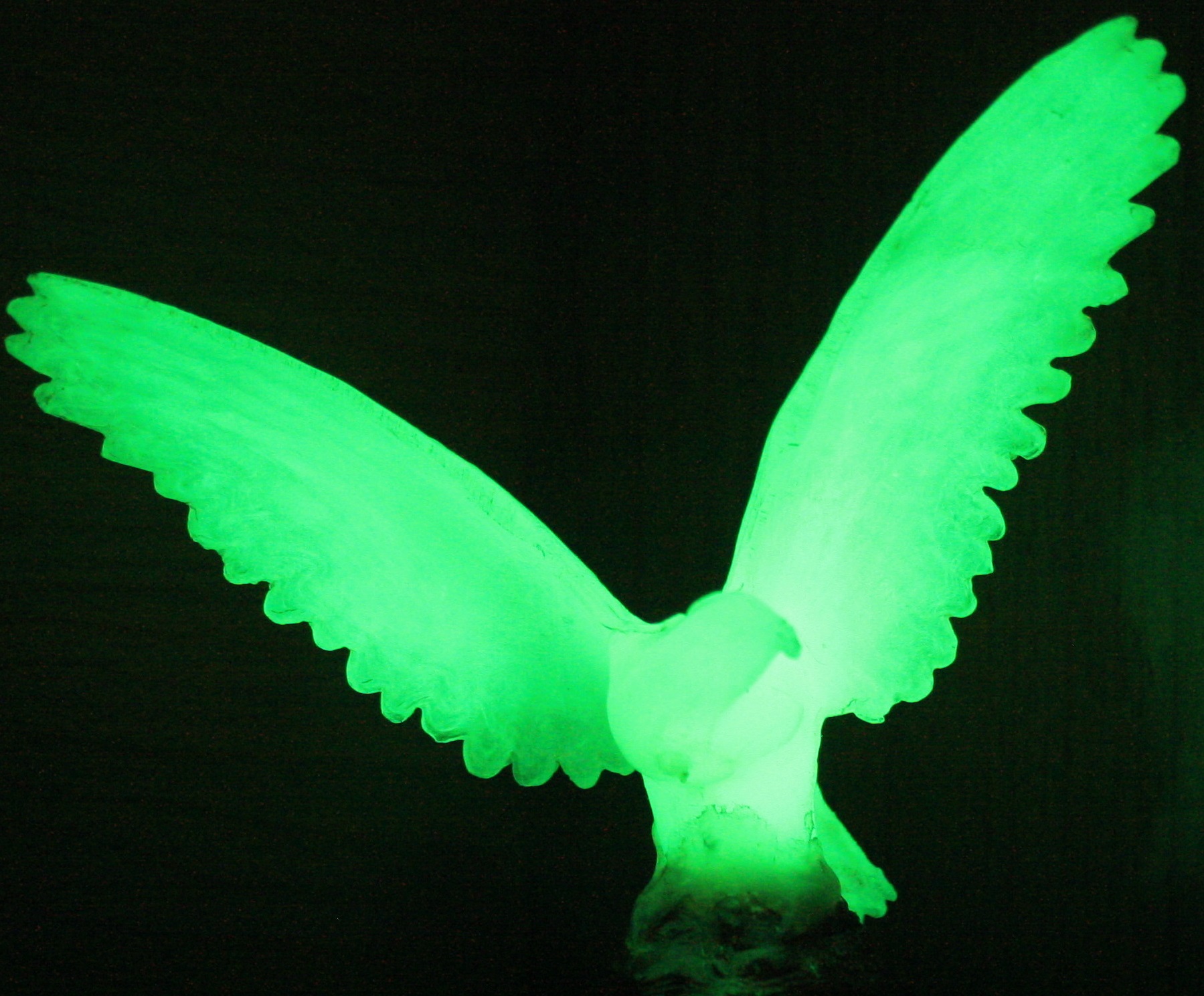A phosphorescent object glowing in the dark after the light has been switched off.