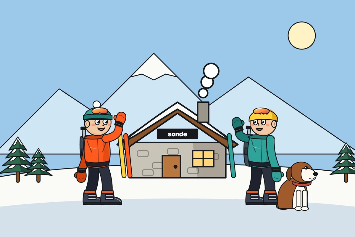 The school’s hut above Andermatt with two guides waving and the school dog sitting in the snow