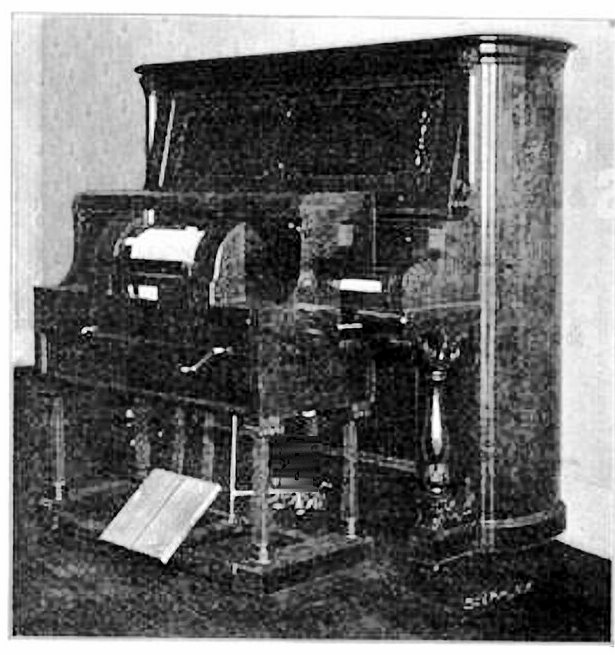 Photograph of the Simplex piano-player, a cabinet that stands at a piano keyboard and plays it
