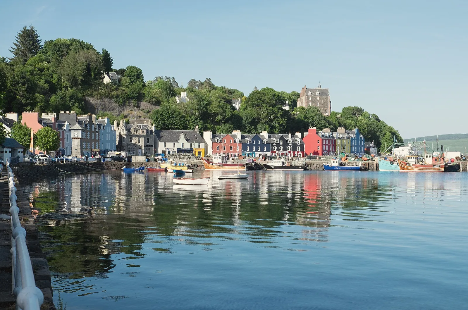 The coloured houses of Main Street, Tobermory, reflected in the harbour