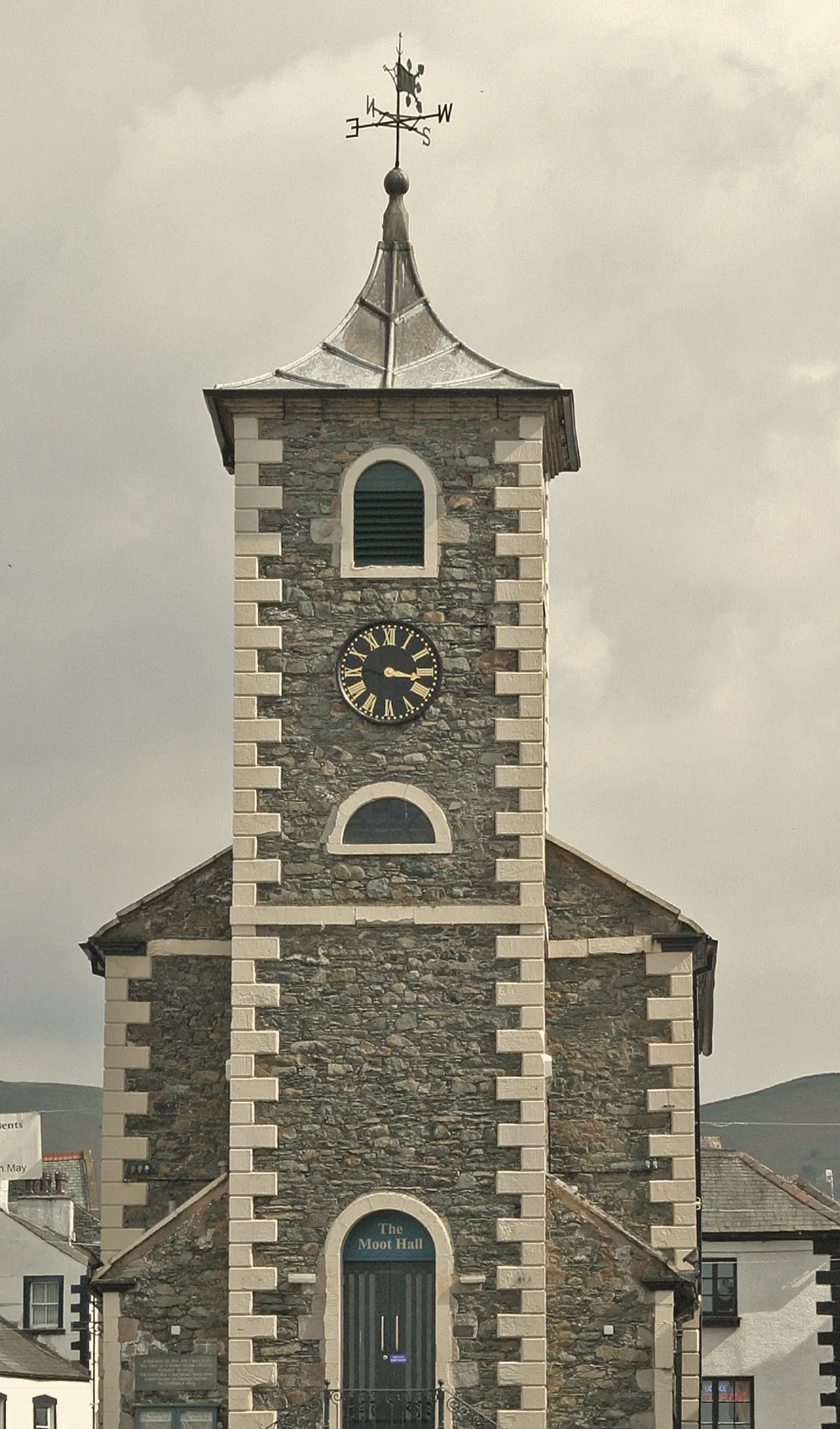 The Moot Hall’s clock tower in Keswick market place, slate and limestone under a grey sky