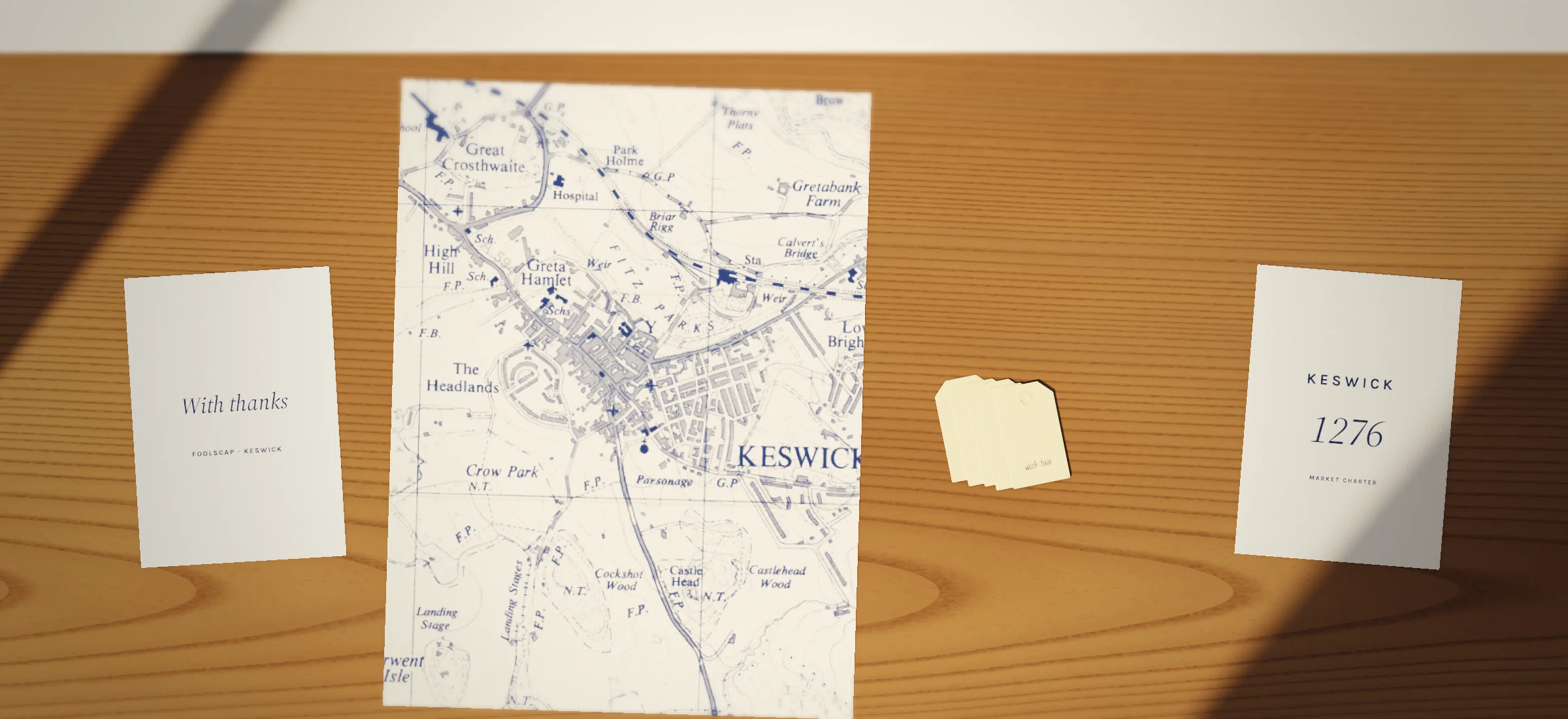 Cards and wrapping on the shelf: letterpress card, with thanks, map wrapping paper, gift tags, letterpress card, keswick 1276