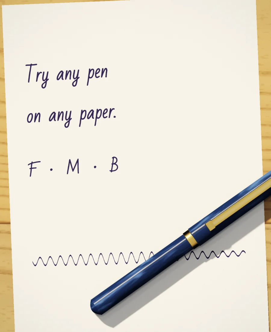 A sheet of wove paper on the counter with “Try any pen on any paper” written on it in blue-black, a navy fountain pen lying across it