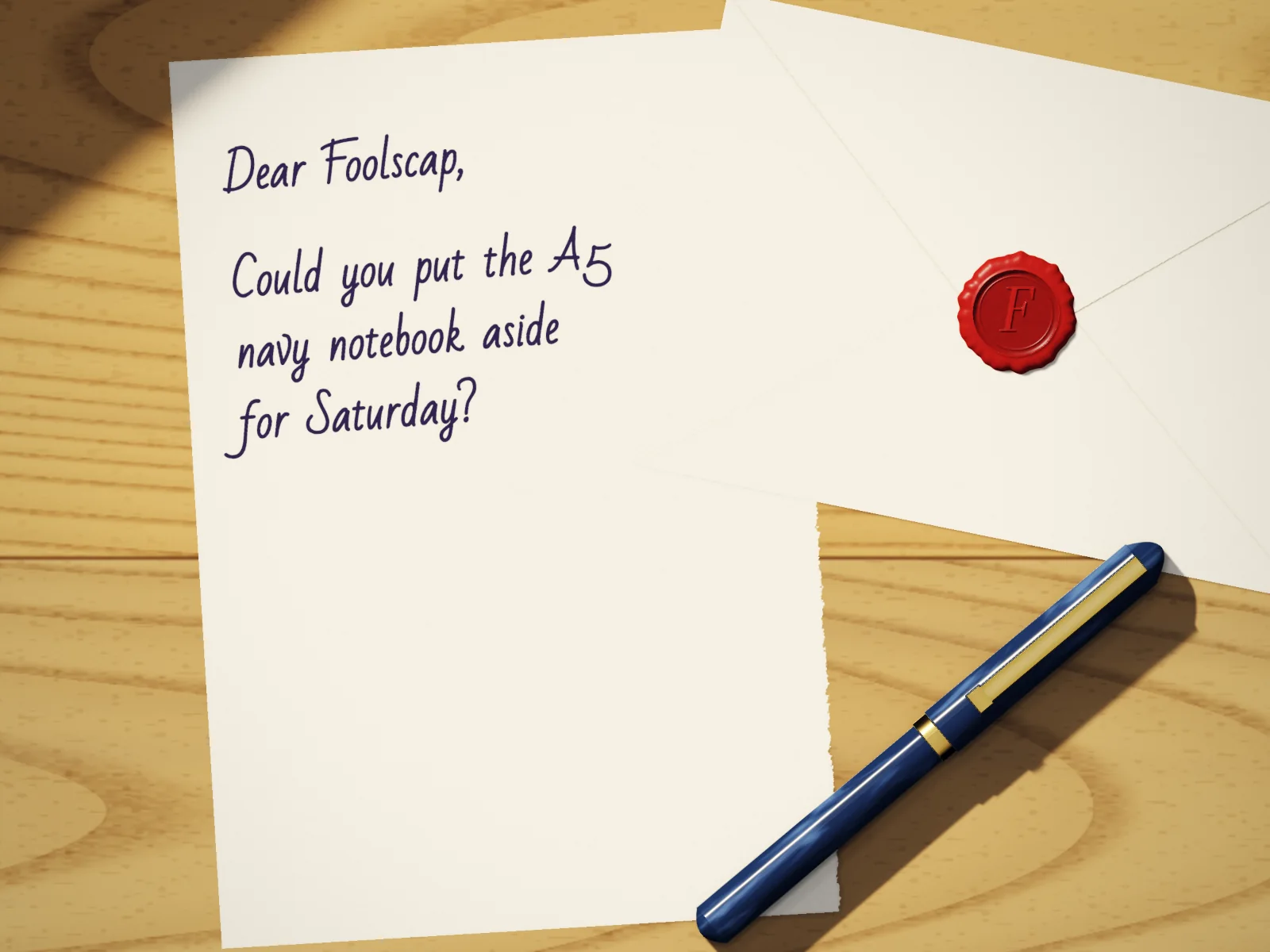 A letter on laid paper, “Dear Foolscap, could you put the A5 navy notebook aside for Saturday?”, beside an envelope with a red wax seal and a fountain pen