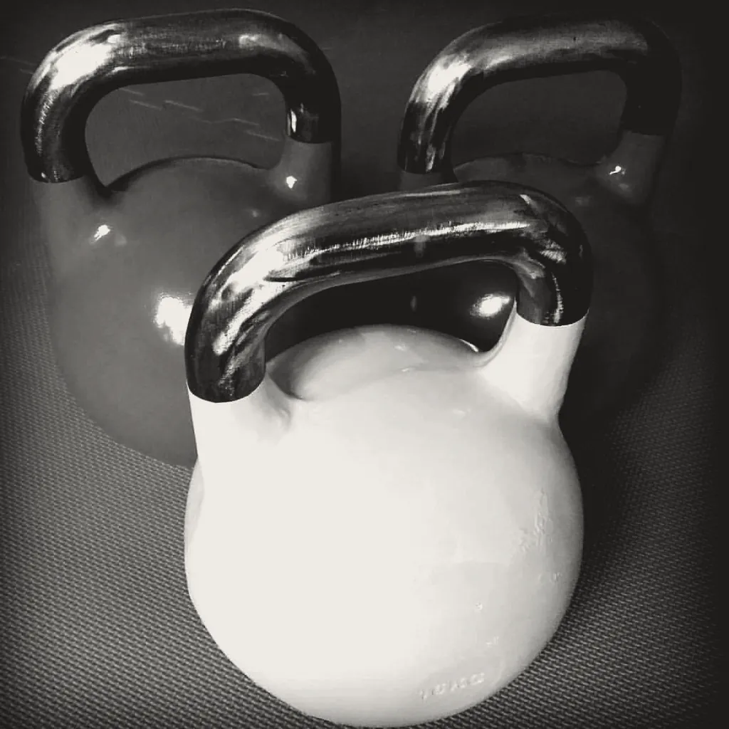 Three competition kettlebells close up.