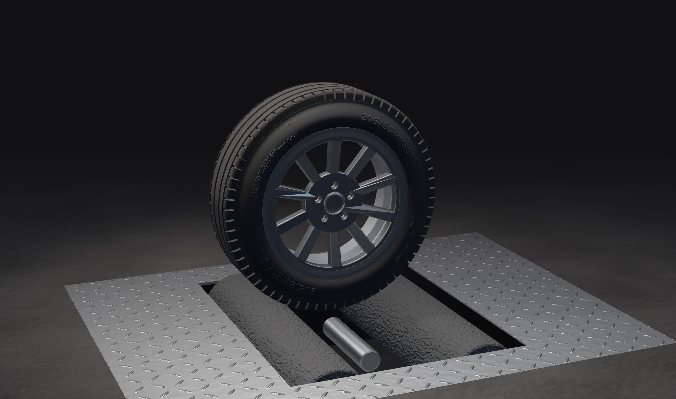 A wheel on the roller brake tester in our lane, lit from above, checker-plate covers around the rollers