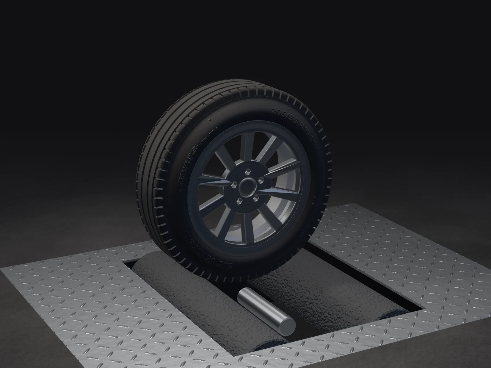 A wheel on the roller brake tester of an inspection lane, checker-plate covers around it
