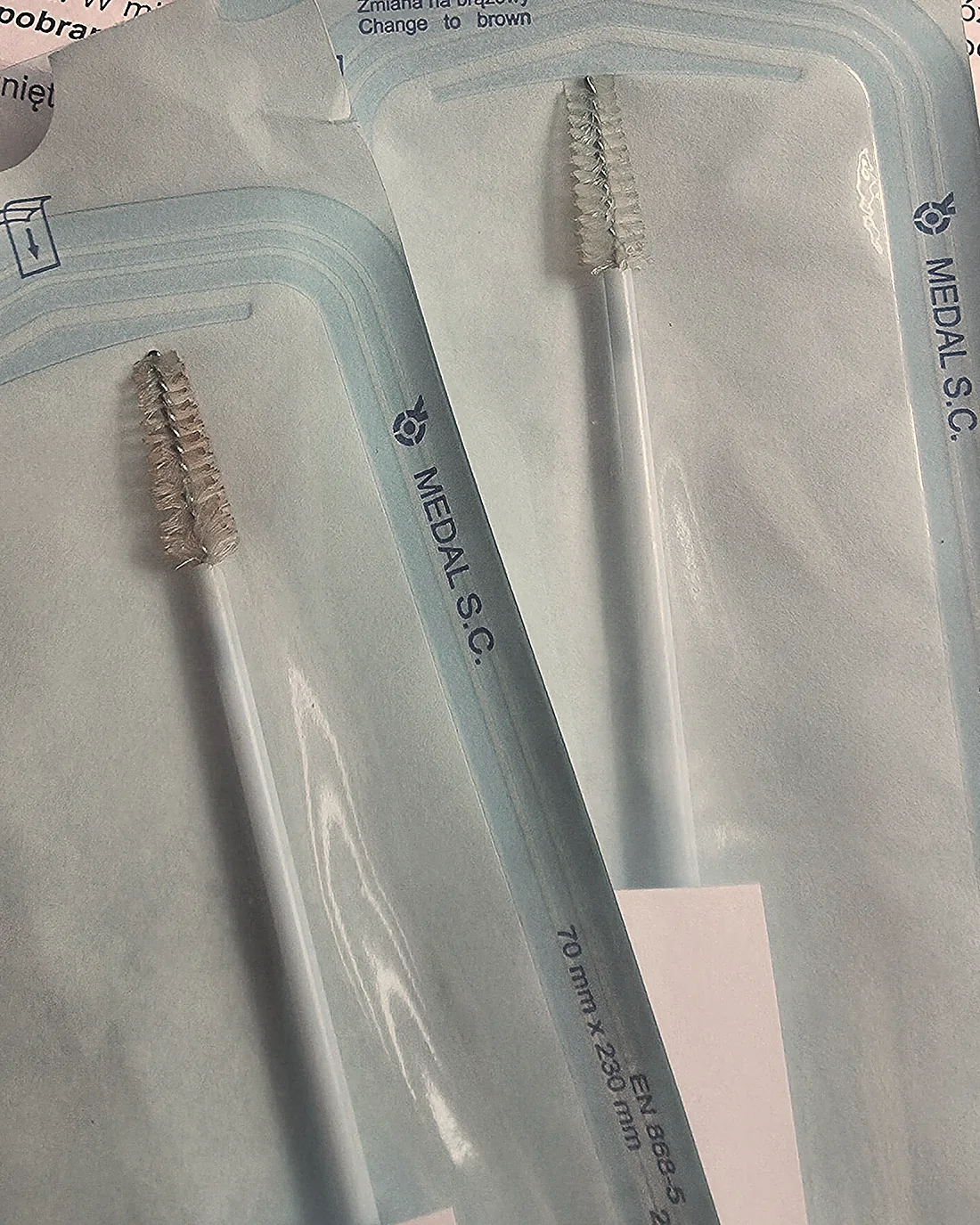Instruments sealed in sterilisation pouches with their indicator strips