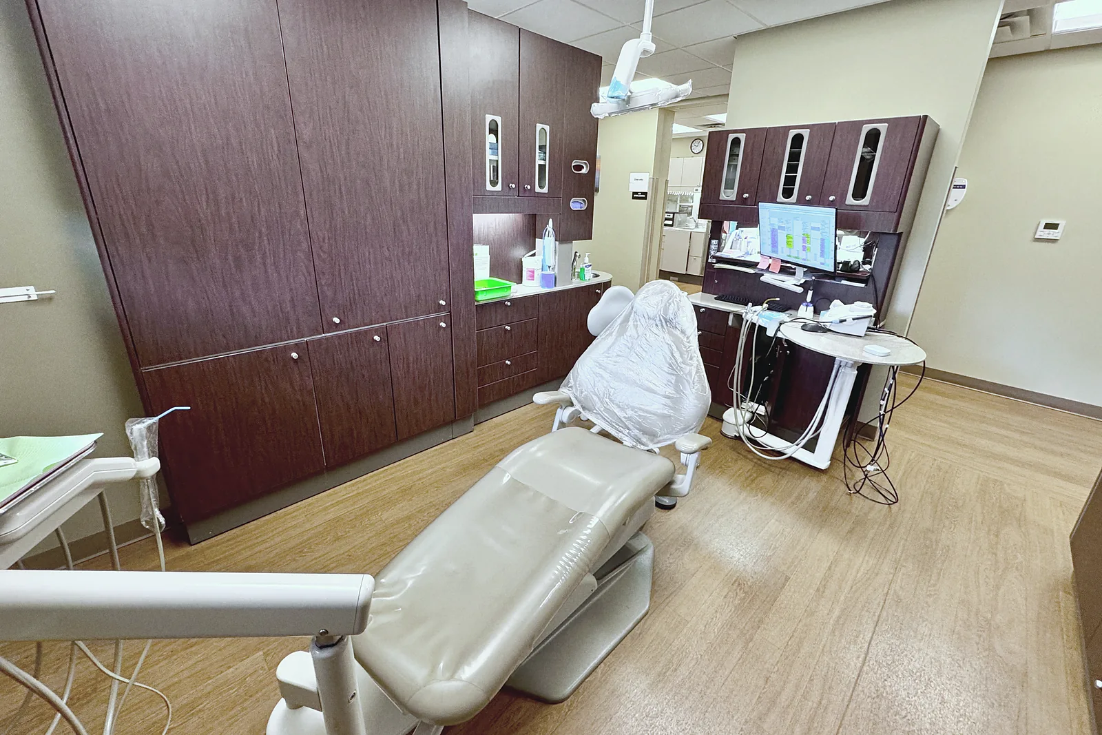 Treatment room one: the chair, the cabinets and the screen for your X-rays