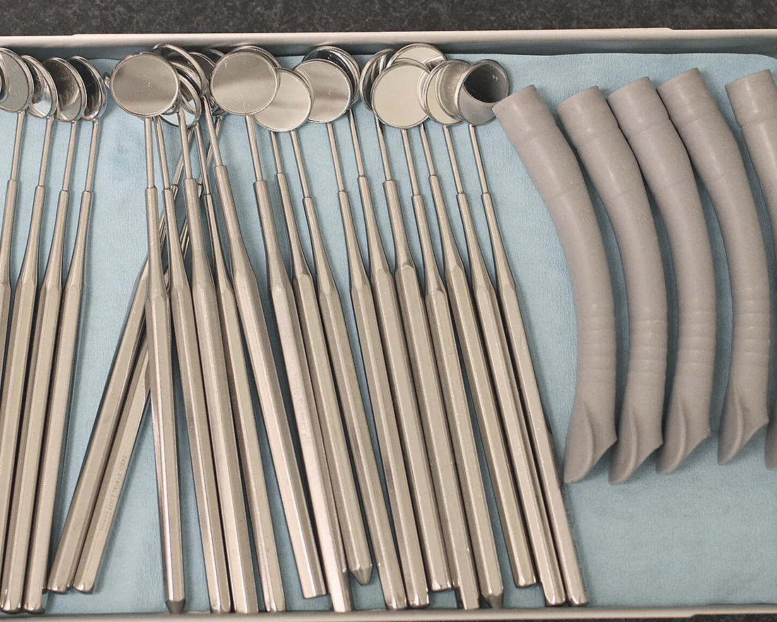 Mirrors, probes and suction tips laid out on a tray