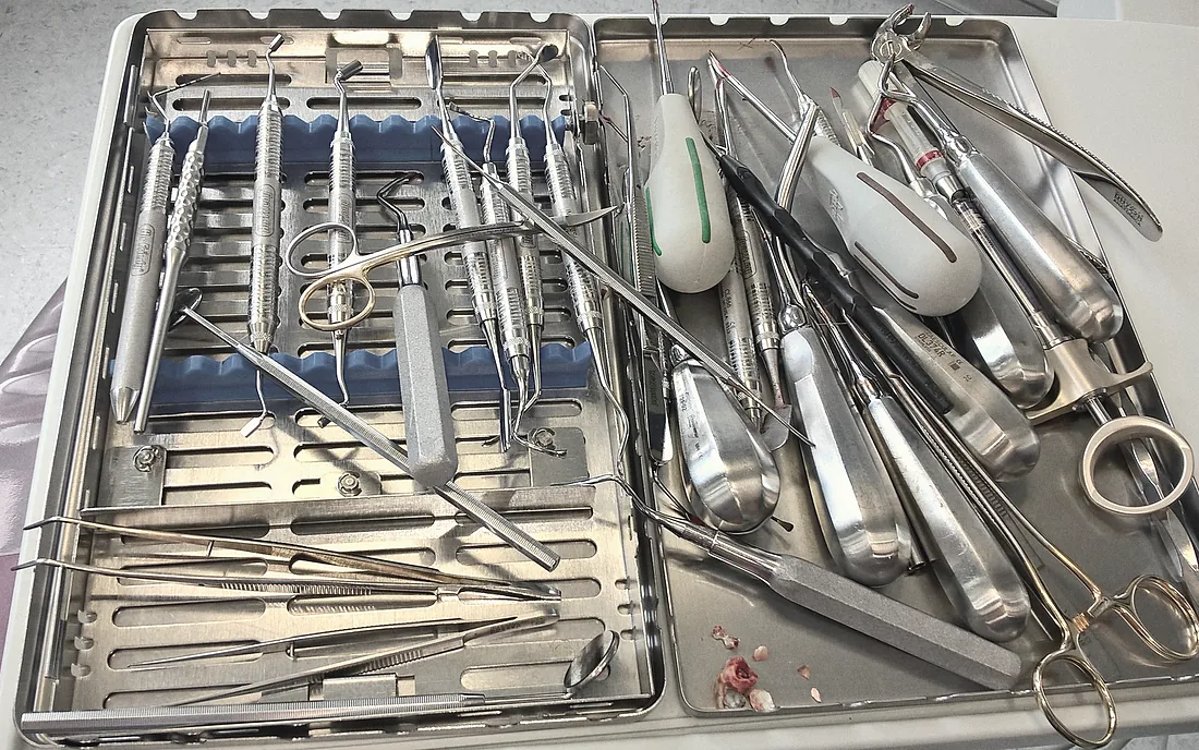 A cassette of instruments waiting to be cleaned, bagged and sterilised