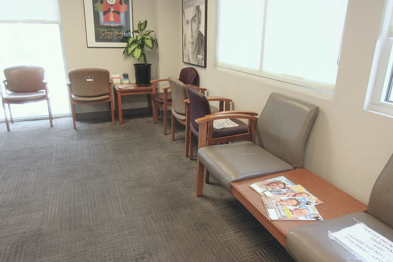 The waiting room: armchairs by a tall window and a low table