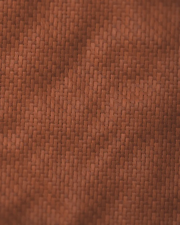 The cloth of No. 05 seen close: rust brushed cotton twill