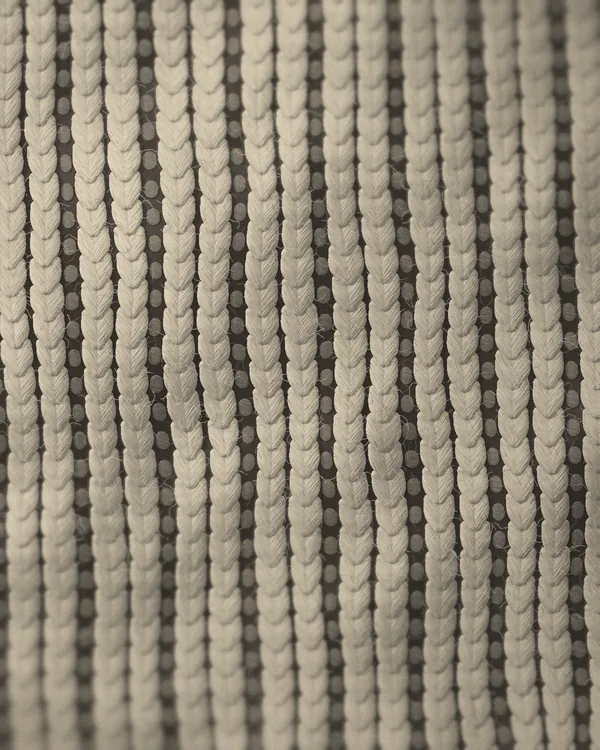 The cloth of No. 10 seen close: undyed wool