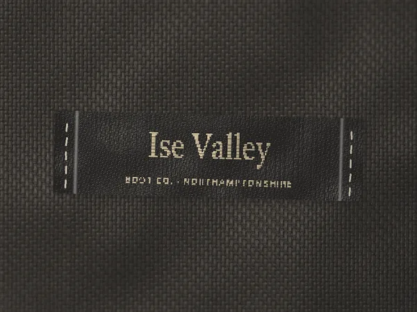 Woven label reading Ise Valley Boot Co., Northamptonshire, on dark canvas