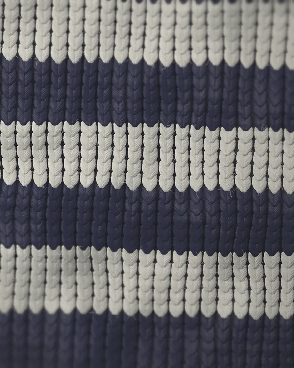 The cloth of No. 11 seen close: navy lambswool, pale grey stripe