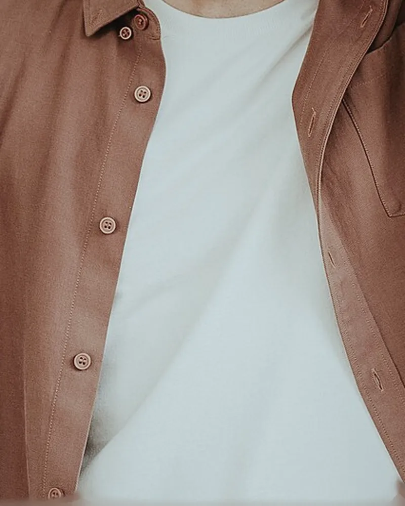 A rust brushed-cotton overshirt worn open over a white T-shirt