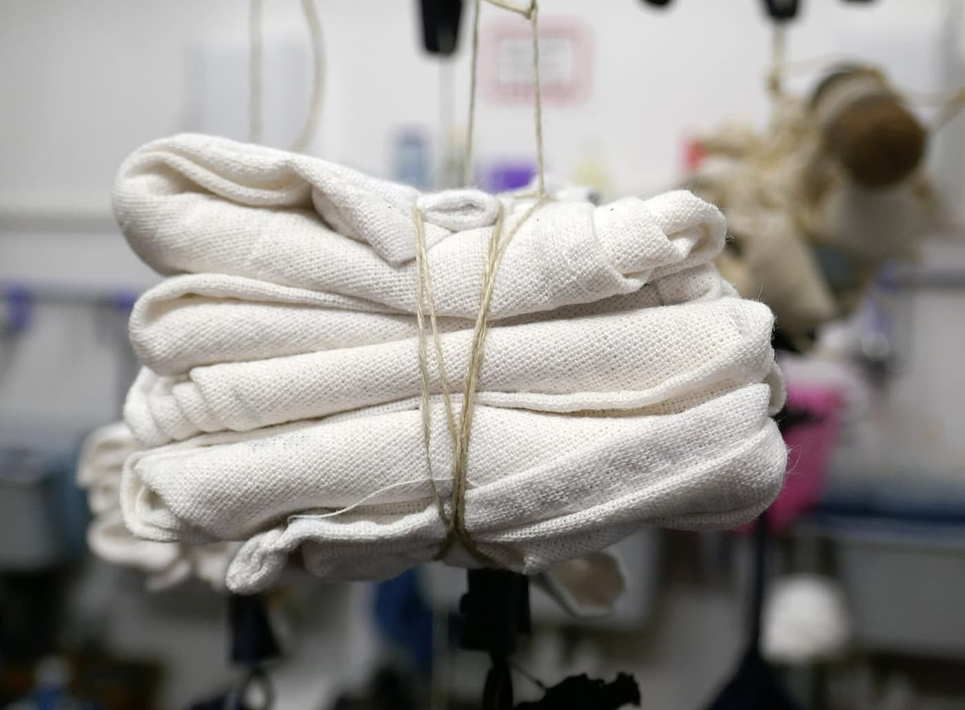 White linen bound tightly with string before dyeing