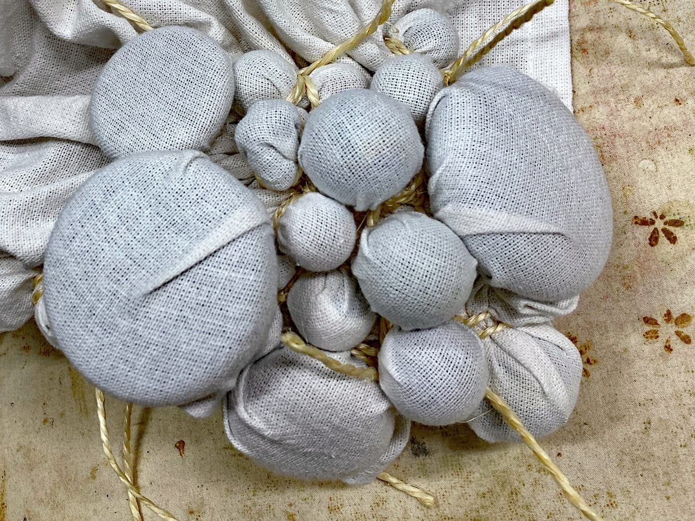 Bundles of bound cloth on a bench