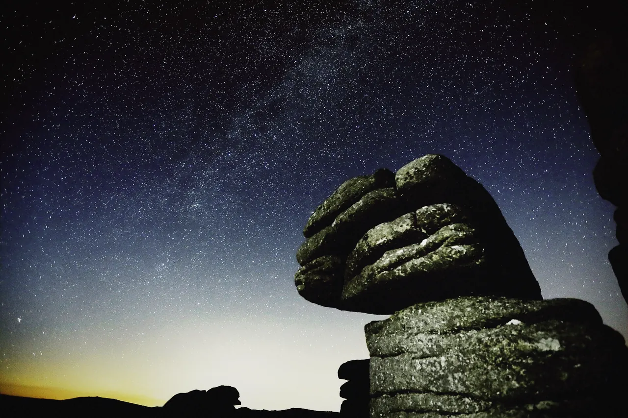 The Milky Way over a dark moorland skyline