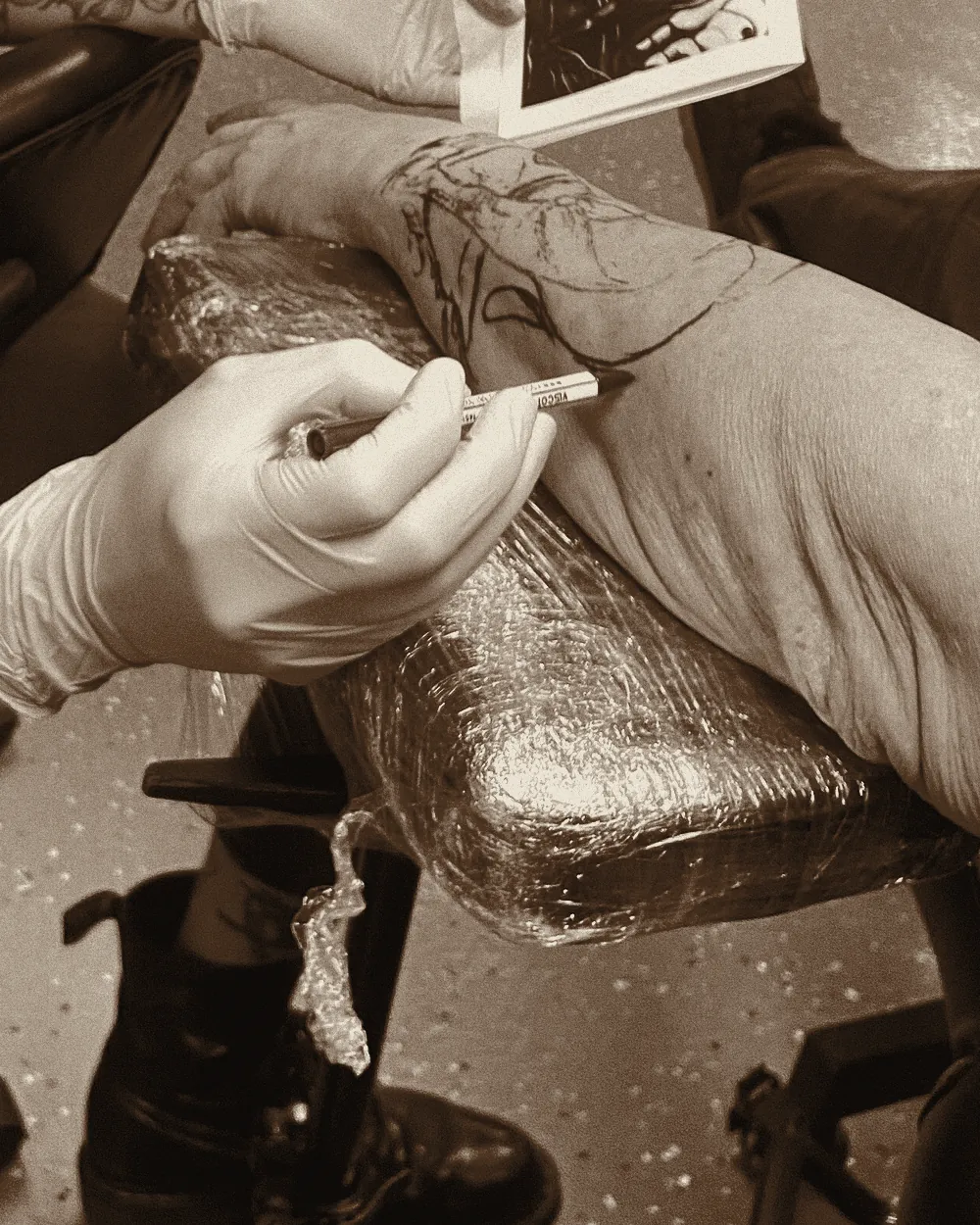 Redrawing part of the stencil freehand so it follows the arm.