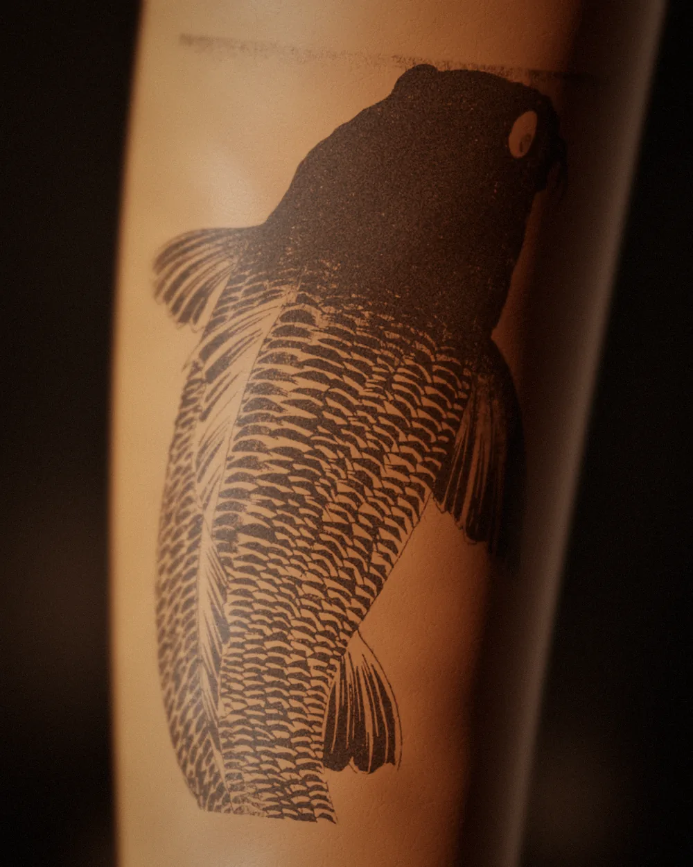Black carp tattoo, after Kuniyoshi, on the forearm, black and grey, healed 2 years