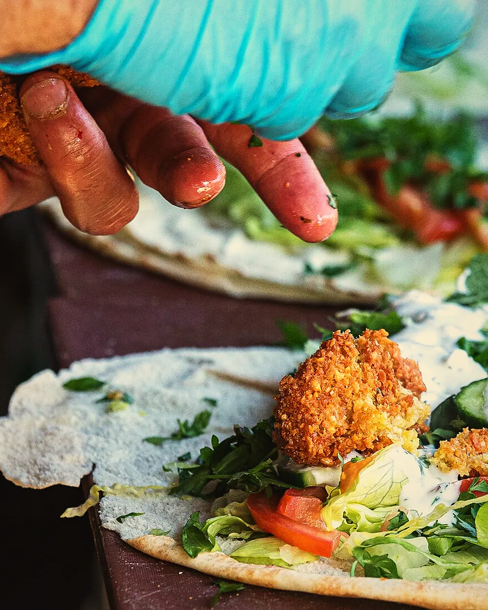 Rolling a falafel wrap